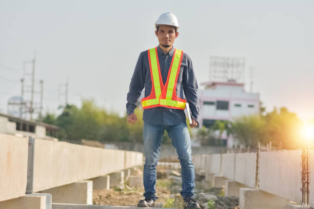 istock Asian man construction safety suit helmet onsite work, Asian man Engineer 1422819281