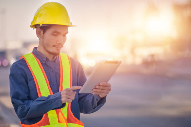 istock Asian man construction safety suit helmet onsite work, Asian man Engineer 1422819562