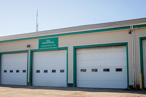 Sherbrooke, Canada - August 28, 2022. Exterior shot of a road maintenance building in rural Nova Scotia.