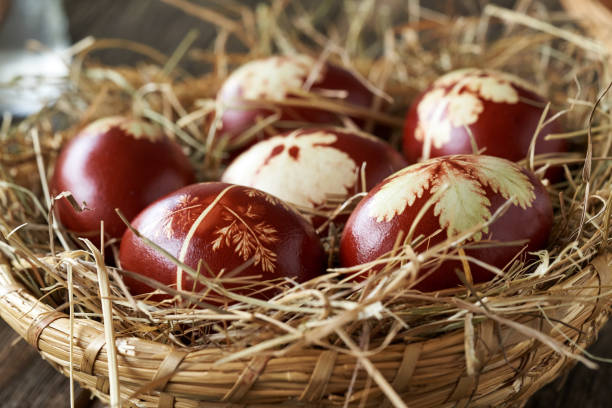 istock Easter eggs dyed with onion peels in a wicker basket in spring 1422820306