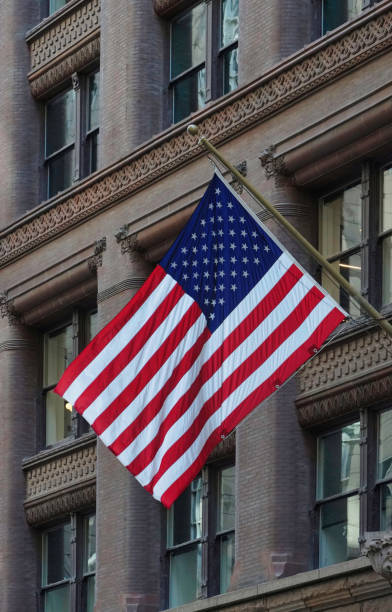 istock American flag flying on an old fashioned, ornate office building 1422824943