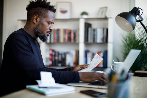 istock Man paying his utility bills online and looking worried 1422826975