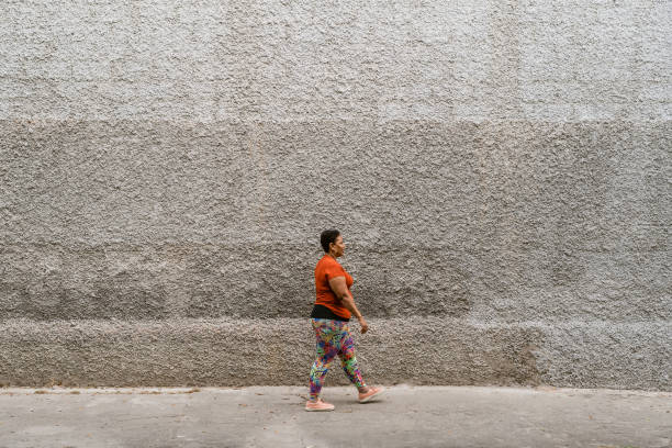 istock Plus size woman walking in the city 1422829239