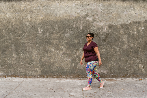Plus size woman walking in the city
