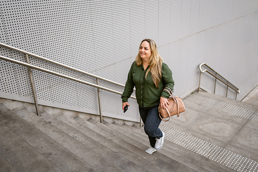 Woman on the way in the financial district