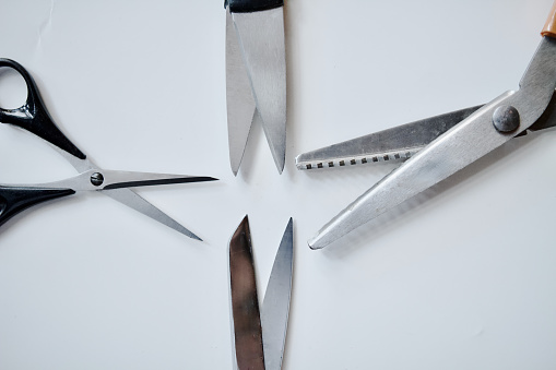 Open Sharp Scissors as Metaphor background