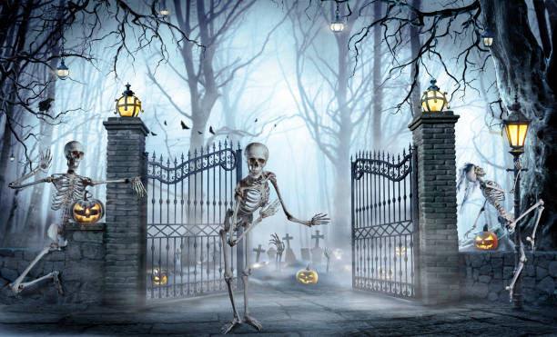 Halloween - Skeleton Inviting A Zombies Party In Cemetery stock photo