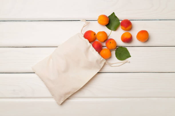 istock Composition with ripe apricots on wooden background, top view 1422836236
