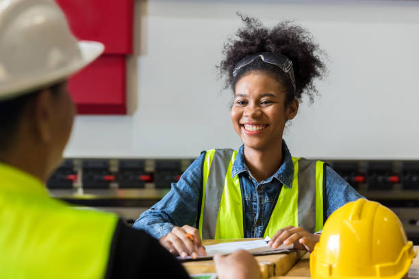 istock African American worker working in warehouse. Industrial and industrial workers concept. worker woman order details and checking goods and Supplies. 1422836298