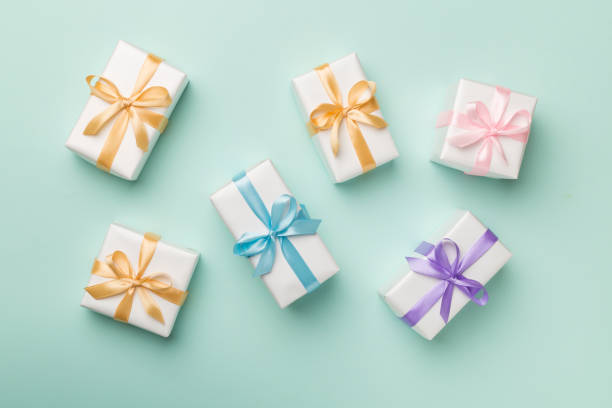 istock Colorful gift boxes on color background, top view 1422837808