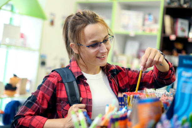 istock Female student buying pencils 1422841431