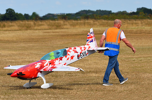 Little Gransden, Cambridgeshire, England - August 28, 2022:  Large Radio Controlled aircraft being pulled accross airfield.