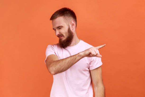 istock Man pointing finger aside, ordering get out looks resentful, boss dismissing from work, showing exit 1422843720