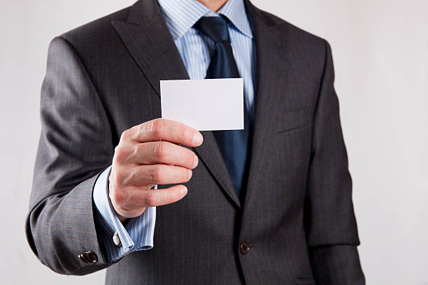 istock Businessman shows business card 142284891