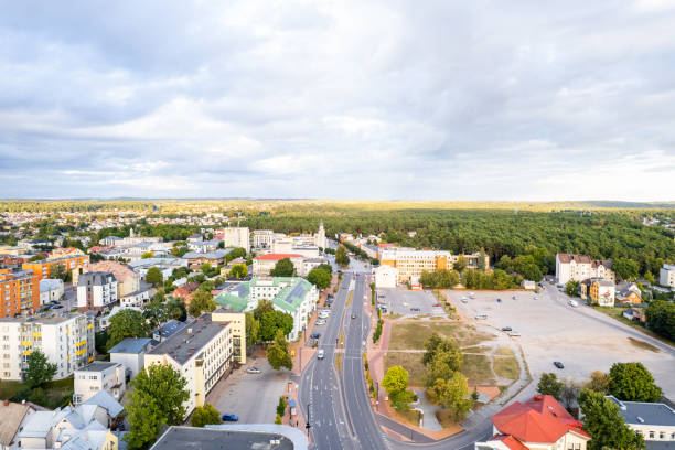 Green city from above at sunset - Stock Image