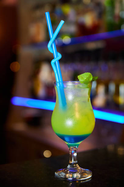 istock Multicolored alcoholic cocktail with mint leaves on the bar counter 1422849098