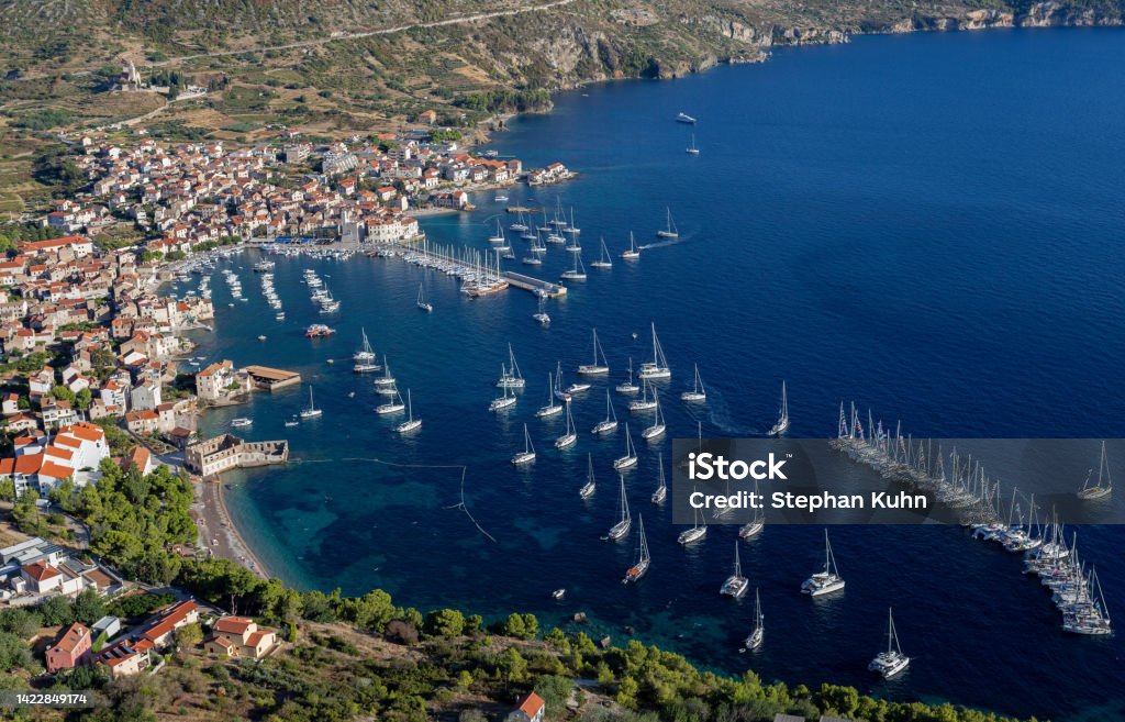 Komiza bay and town Komiza, Vis Island, Croatia on September 5, 2017: view from the surrounding mountains on Komiza town  and harbour Adriatic Sea Stock Photo