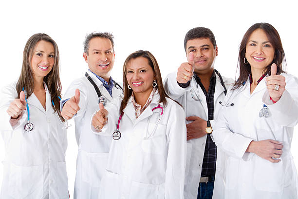 Doctors with thumbs up Group of doctors with thumbs up - isolated over a white background yes single word stock pictures, royalty-free photos & images