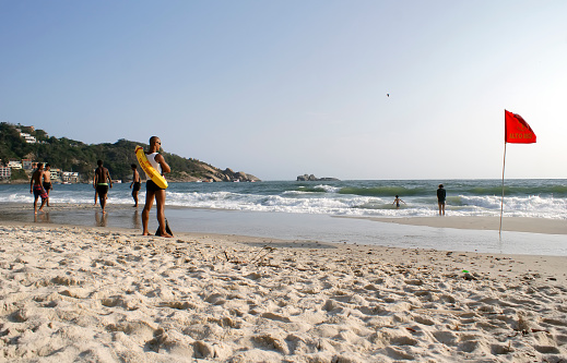 September 03, 2022. Barra de Guaratiba, Rio de Janeiro, Brazil. Man saves lives attentive to bathers on the beach.