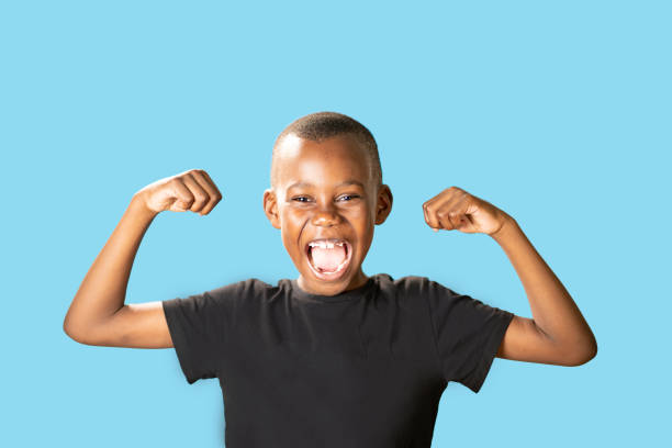istock 8 year old boy happy to have won 1422854952