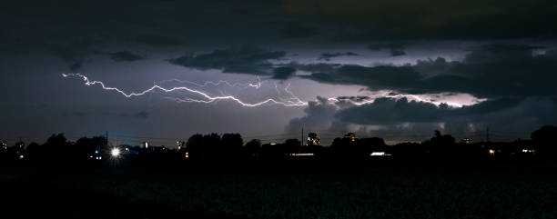 istock Long horizontal bolt of lightning cleaves the night sky 1422855992
