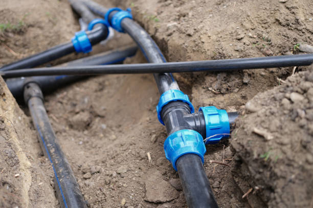 istock Connecting water supply closeup on background of earth 1422856385