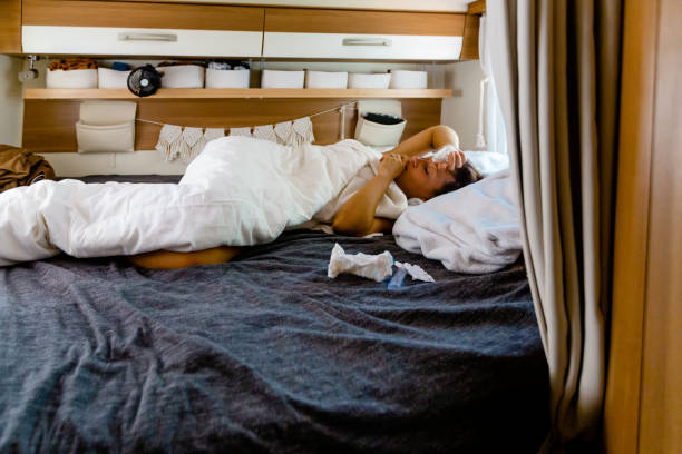 istock woman is in bed in the caravan - sick 1422859064