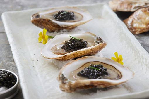 Raw Oysters on Ice with Caviar and Lemon Wedges