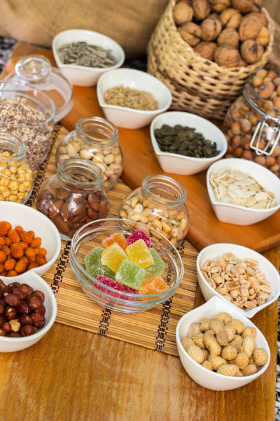 istock Assortment of nuts on rustic wood table 1422861950