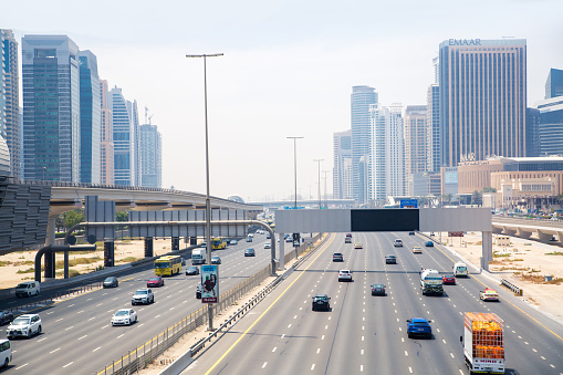 Dubai, UAE - September 2, 2022:  Sheikh Zayed road, the main road of Dubai view with cars and Dubai Marina skyscrapers