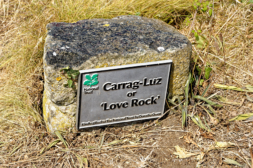 Sign of Love Rock or Karrek Kerenza at Mullion Cove. Granite Rocky Love Rock Overlooking the Atlantic Ocean in the Seaside Village of Mullion Cove in Rural Cornwall, England - UK. 13th of August 2022