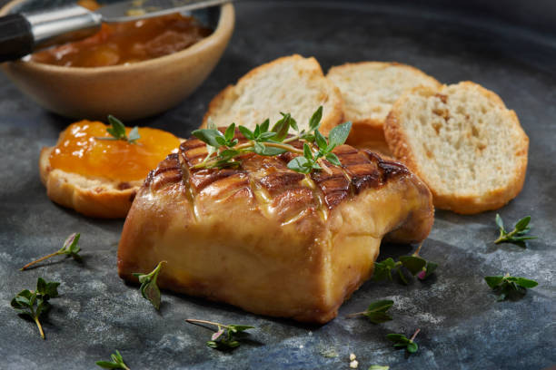 Seared Foie Gras Seared Foie Gras with Apricot Preserves and Toasted Crostini's foie gras stock pictures, royalty-free photos & images