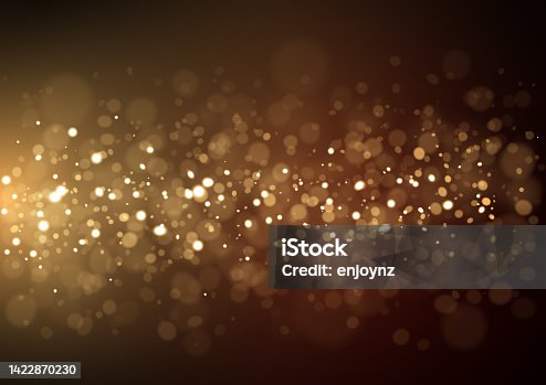 istock Glittering abstract golden Christmas lights 1422870230