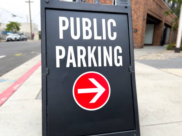 Black Public Parking sign on the sidewalk stock photo