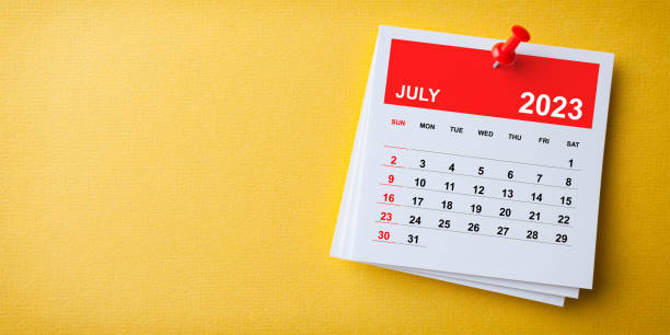 istock White Sticky Note With 2023 July Calendar And Red Push Pin On Blue Background 1422875303