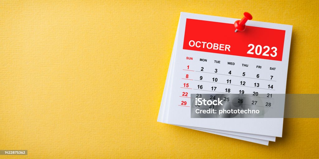 White Sticky Note With 2023 October Calendar And Red Push Pin On Blue Background 2023 Stock Photo