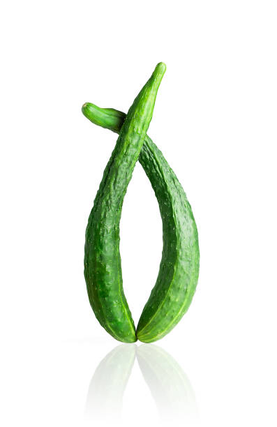 istock Crooked cucumbers on a white background, isolated, with reflection. 1422876026