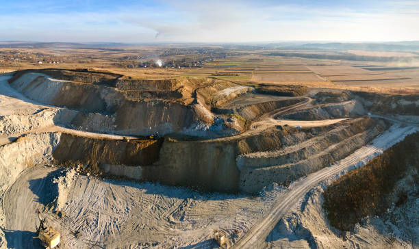 istock Aerial view of open pit mining site of limestone materials for construction industry with excavators and dump trucks 1422876129