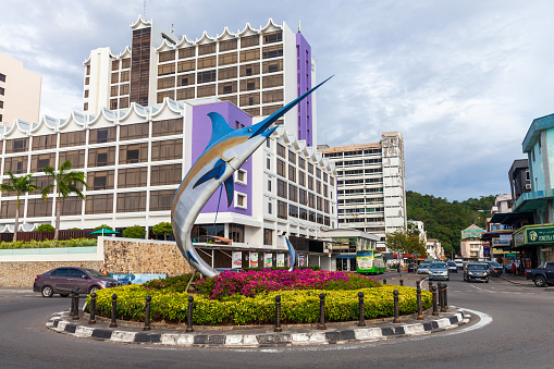Kota Kinabalu, Malaysia - March 23, 2019: Marlin Statue mounted on roundabout in central district of Kota Kinabalu city