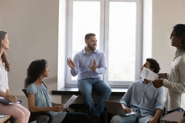 istock Cheerful confident business team leader discussing marketing data 1422877498
