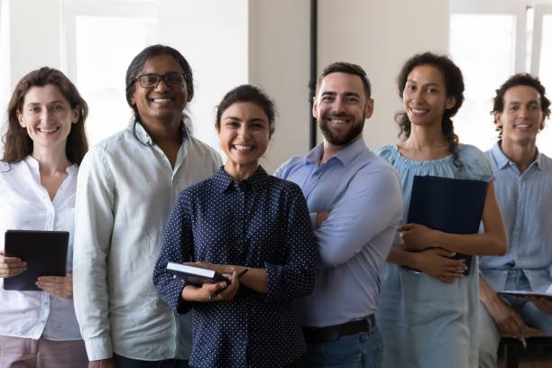 istock Diverse successful team of happy office workers of different races 1422877509