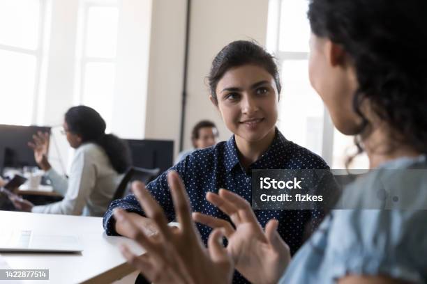 Happy Indian Intern Listening To Mentor Consulting Corporate Teacher Stock Photo - Download Image Now