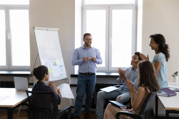 istock Happy satisfied business leader man getting applause from audience 1422877639