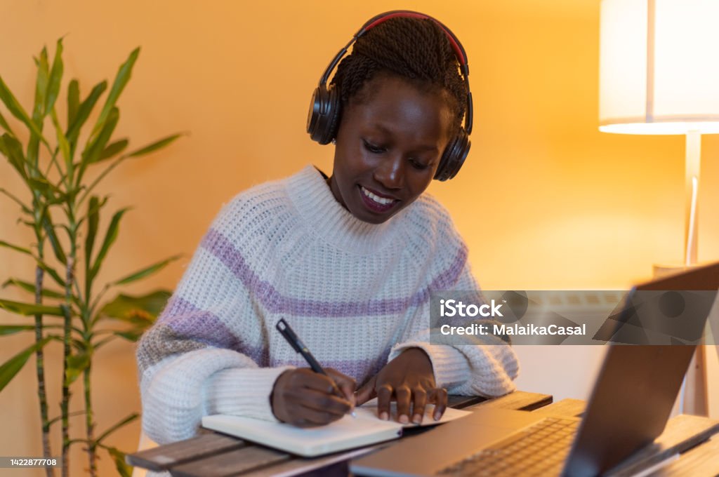 Remote working/e learning Young cheerful woman having online classes/working from home 25-29 Years Stock Photo