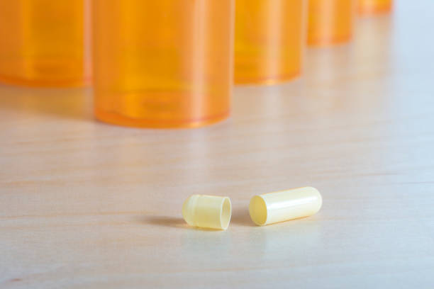 istock Prescription drug containers and pill capsule 1422878760