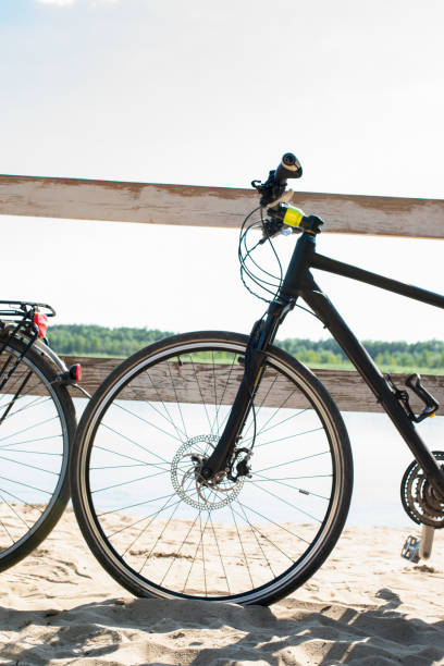 istock Bicycle wheel on the beach with overlooking the lake 1422879079