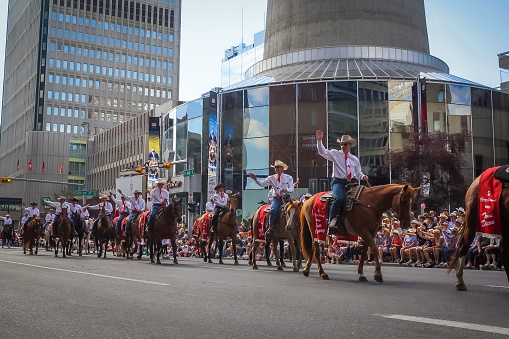 Calgary, Canada - Calgary city council (I think)  featured in the (Calgary) Stampede Parade coming through downtown. The parade marks the start of the Calgary Stampede rodeo festival. Taken in July 2017.
