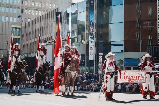 Canadian Cowgirls- Rodeo Drill Team in the Calgary Stampede Parade 4 Calgary, Canada - July, 2017: Canadian Cowgirls- Rodeo Drill Team in the (Calgary) Stampede Parade coming through downtown. The parade marks the start of the Calgary Stampede rodeo festival. Taken in July 2017. scotiabank saddledome stock pictures, royalty-free photos & images