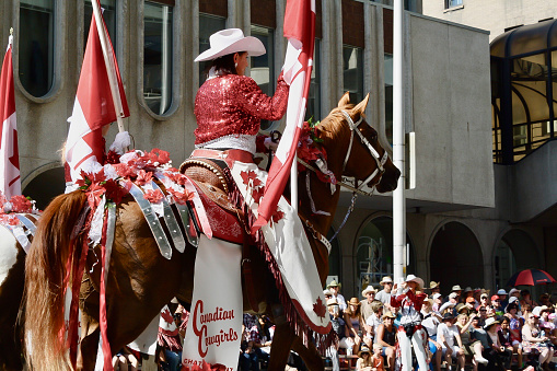 Calgary, Canada - July, 2017: Canadian Cowgirls- Rodeo Drill Team in the (Calgary) Stampede Parade coming through downtown. The parade marks the start of the Calgary Stampede rodeo festival. Taken in July 2017.