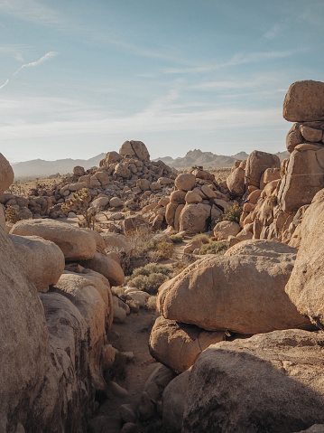 This is a wide angle photograph of a small tent setup at the Jumbo Rocks Campground in Joshua Tree National Park in the Mojave Desert, California.